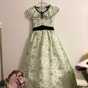 This is a Scarlet O’hara dress and sun hat from the movie Gone With The Wind.